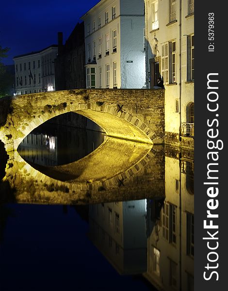 View of a canal in Bruges (Belgium) at blue hour. View of a canal in Bruges (Belgium) at blue hour