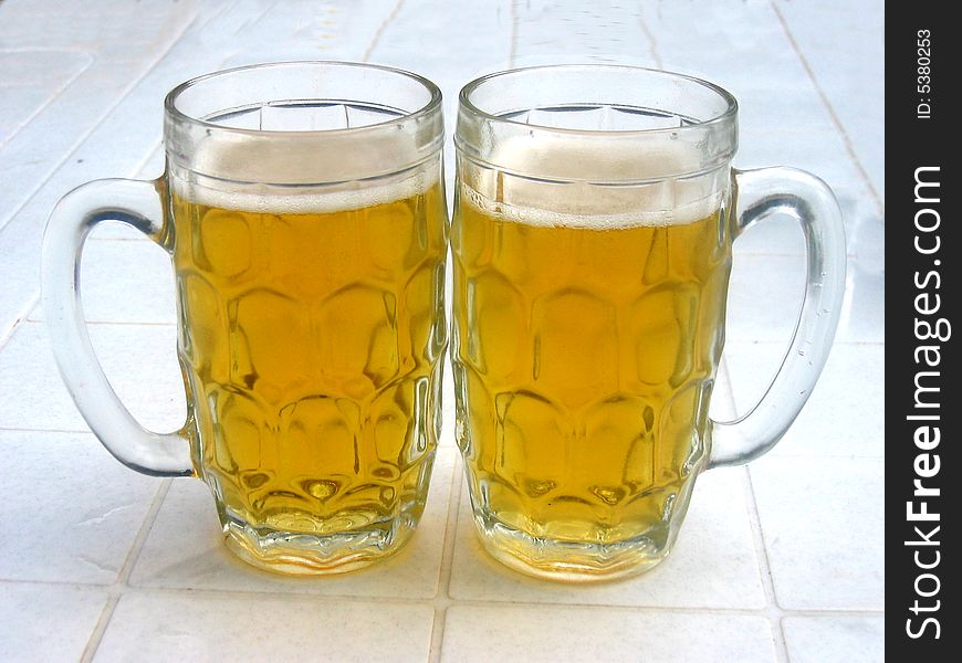A couple of beer glasses. A couple of beer glasses