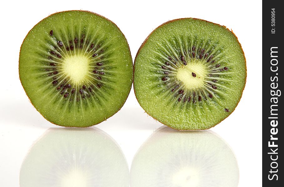 Kiwi cut in half with a reflection