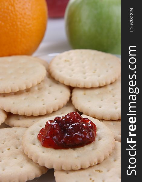 Round cakes with fruity jam on the plate