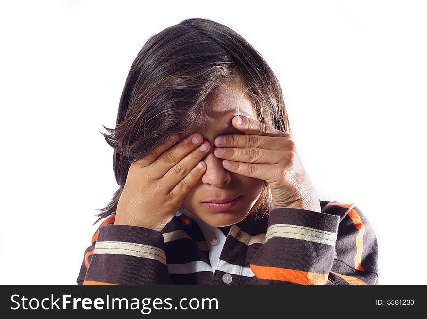 Young Child with his eyes closed by his hands. Young Child with his eyes closed by his hands.