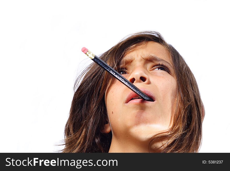 Young child with a pencil sticking out of his mouth. Young child with a pencil sticking out of his mouth.