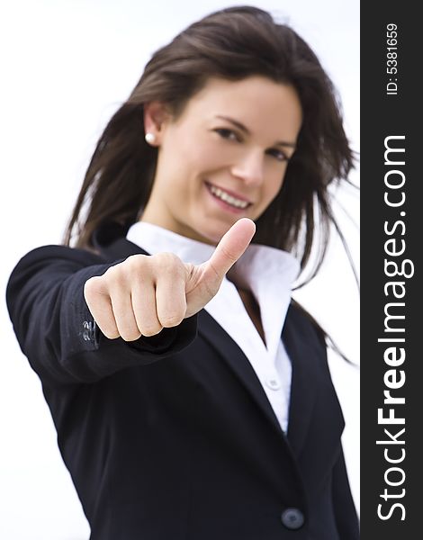 Succesful businesswoman, focus on thumb. Succesful businesswoman, focus on thumb