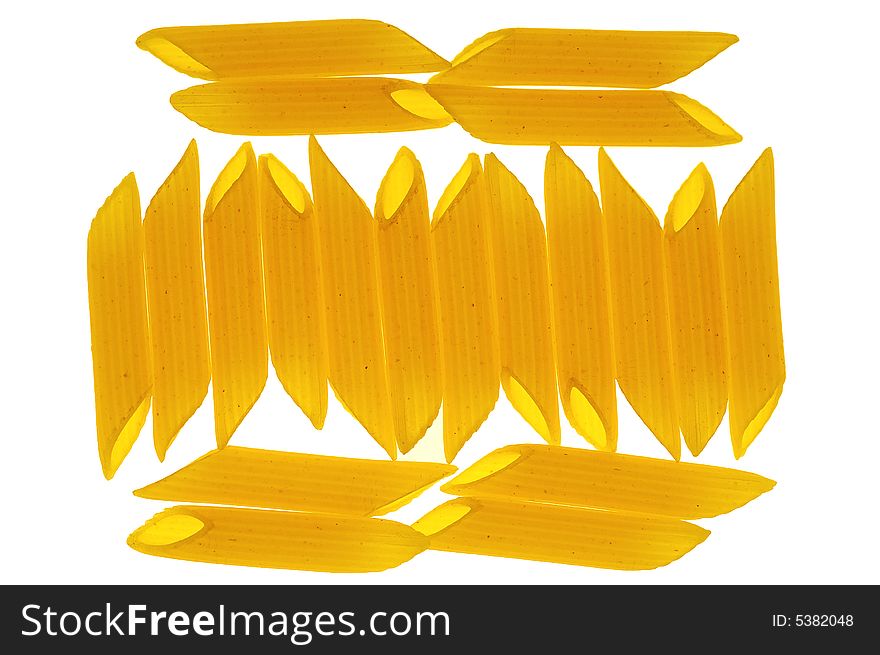 Italian pasta penne rigate isolated in back light white background. Italian pasta penne rigate isolated in back light white background