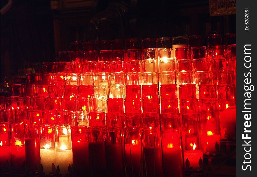 Glowing candles in a church. Glowing candles in a church