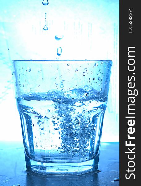 Blue glass and water splash