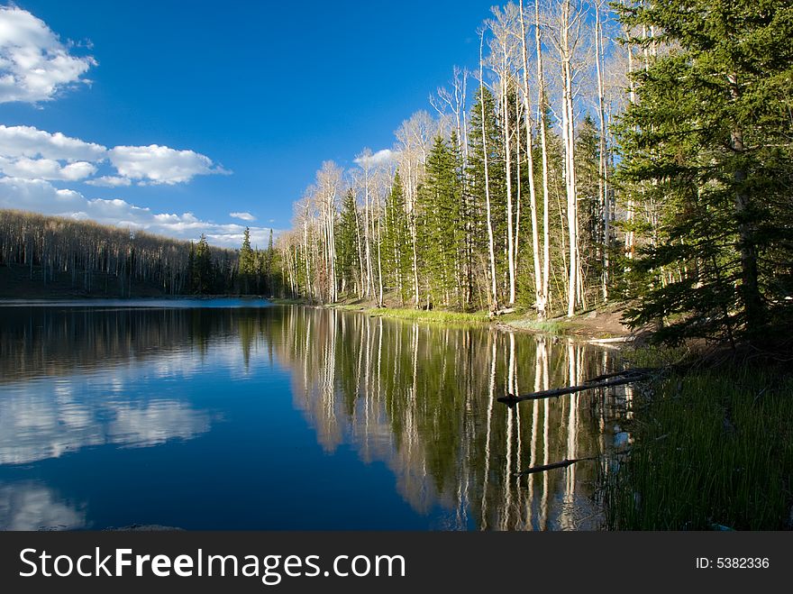 Glassy vacation lake in glorious untouched mountain range