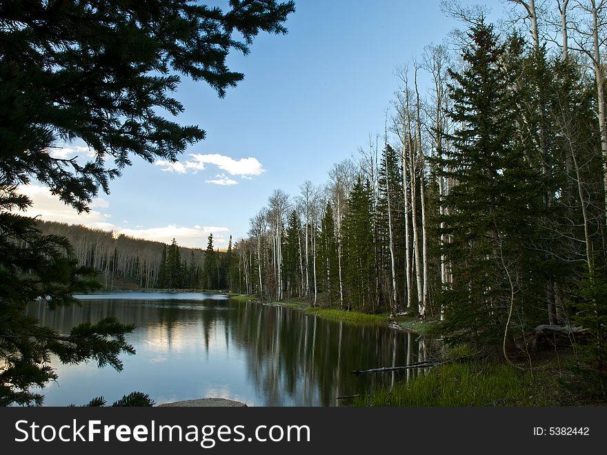 Color image of iconic mountain lake with pine and aspen trees. Color image of iconic mountain lake with pine and aspen trees