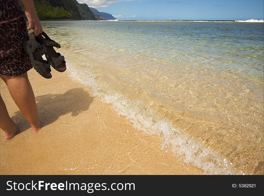 Woman Walks on the Na Pali Shoreline