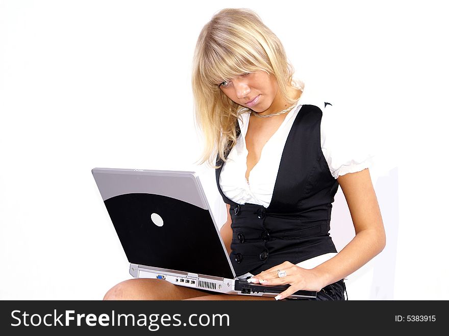 Young blond woman working on laptop white background. Young blond woman working on laptop white background.