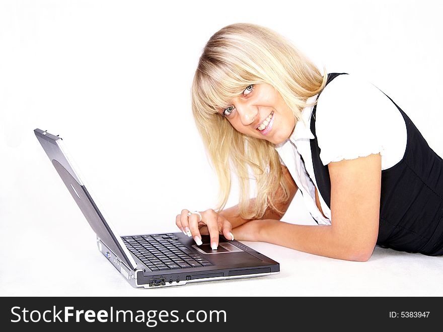 Young blond businesswoman working on laptop. Young blond businesswoman working on laptop.