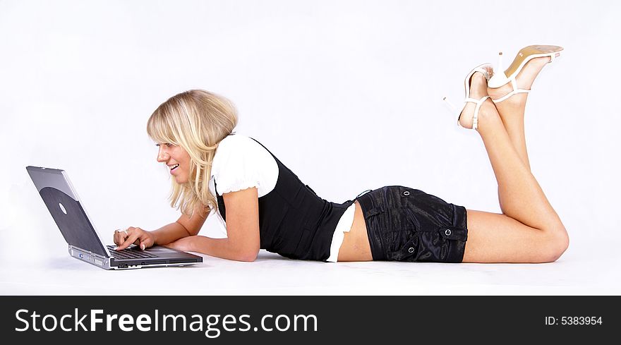 Young businesswoman working on floor with laptop. Young businesswoman working on floor with laptop.