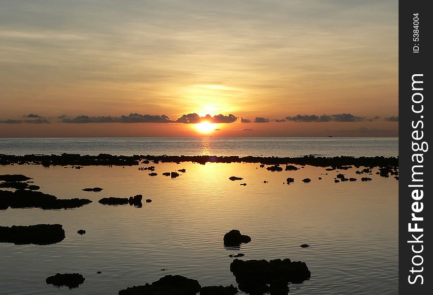 The evening sun heads for home s seen from Bandos Island in the Maldives. The evening sun heads for home s seen from Bandos Island in the Maldives