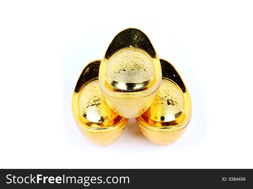 Decoration of chinese gold ingots in isolated white backgroun