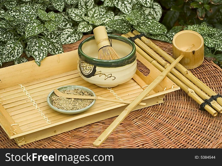 Traditional Japanese Tea Set surrounded by foliage