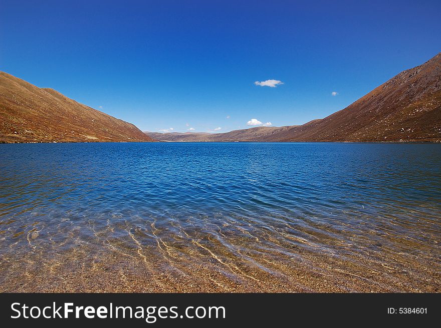 When travelling in Tibet of China, a  beautiful lake appears in front of us.