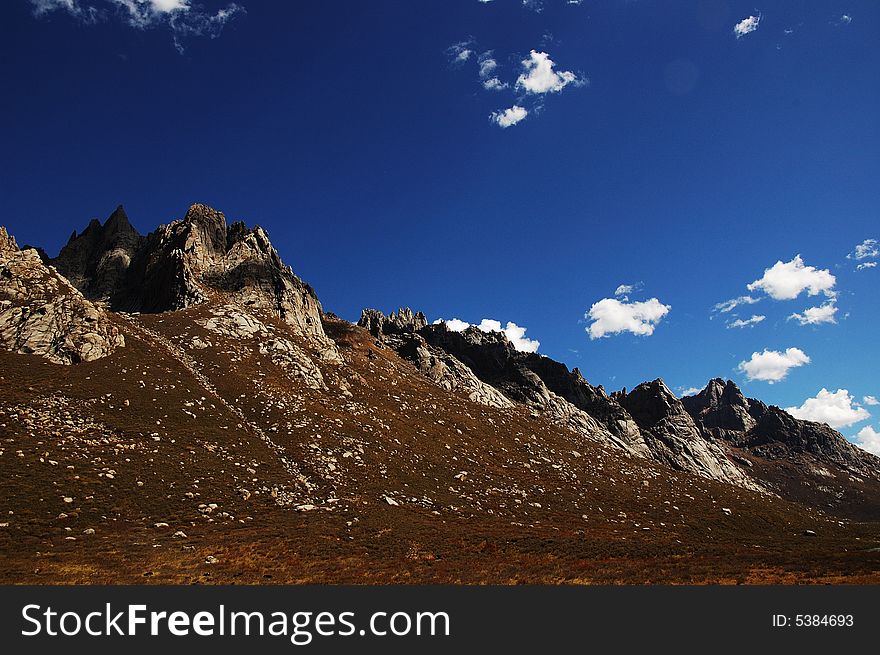 When travelling in Tibet of China,  grand mountains appear in front of us. When travelling in Tibet of China,  grand mountains appear in front of us.