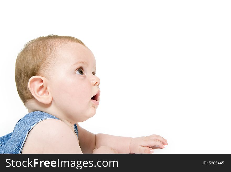 Six month old baby wearing jeans overall with the american flag isolated on white. Six month old baby wearing jeans overall with the american flag isolated on white