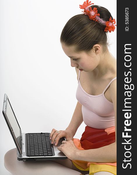 Teen girl sitting on a floor whith notebook computer. Teen girl sitting on a floor whith notebook computer