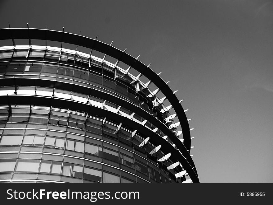 Picture of a glass and metal architecture. Suitable for architecture, construction or modern city context.