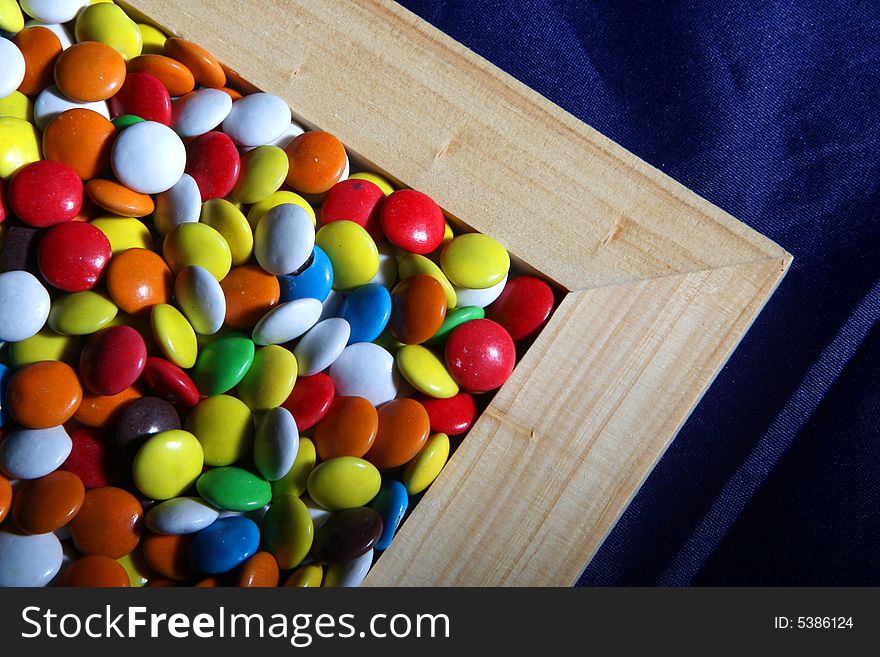 Many colored candies and a frame