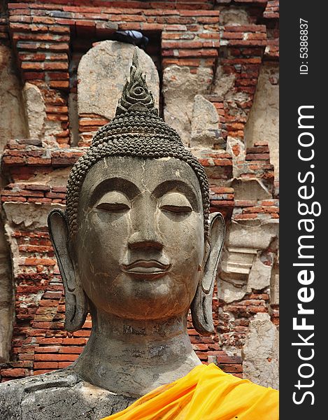 In Thailand the city of Ayutthaya was founded in 1350 today is an impressive archaeological park; here a buddha's face at the Wat Phra Mahathat. In Thailand the city of Ayutthaya was founded in 1350 today is an impressive archaeological park; here a buddha's face at the Wat Phra Mahathat