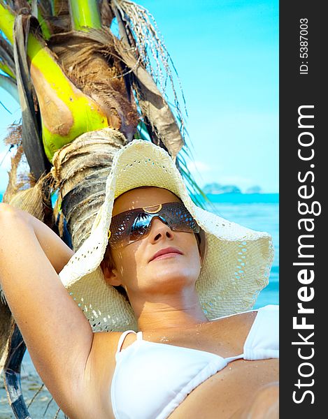 View of nice woman having fun on tropical beach. View of nice woman having fun on tropical beach