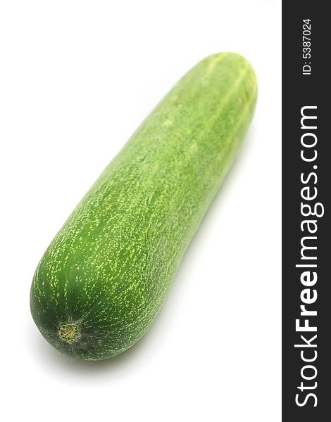 Close up of a cucumber over white background.
