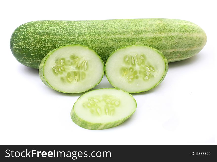 Cucumber and slices isolated on white background. Cucumber and slices isolated on white background.