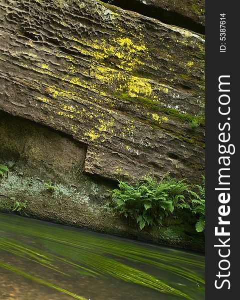 Rock with flowing water in national park Bohemian Switzerland. Rock with flowing water in national park Bohemian Switzerland