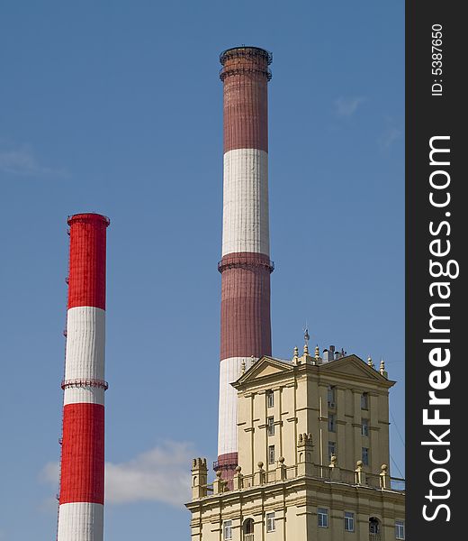 Red and white striped chimneys of a power station. Red and white striped chimneys of a power station