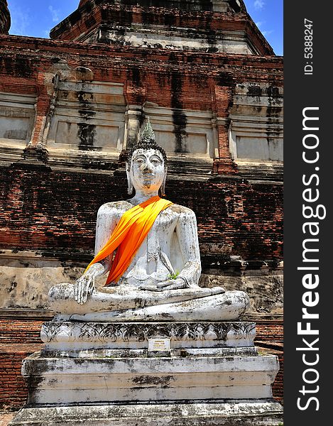 In Thailand the city of Ayutthaya was founded in 1350 today is an impressive archaeological park; here a view of a seated  Buddha at Wat Yai Chai Mongkhon. In Thailand the city of Ayutthaya was founded in 1350 today is an impressive archaeological park; here a view of a seated  Buddha at Wat Yai Chai Mongkhon