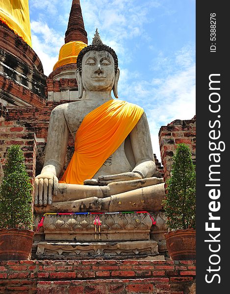 In Thailand the city of Ayutthaya was founded in 1350 today is an impressive archaeological park; here a view of a seated Buddha at Wat Yai Chai Mongkhon. In Thailand the city of Ayutthaya was founded in 1350 today is an impressive archaeological park; here a view of a seated Buddha at Wat Yai Chai Mongkhon