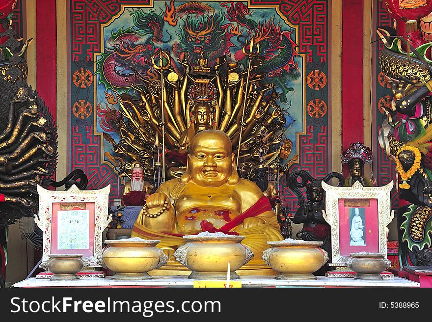 In Thailand the city of Ayutthaya was founded in 1350 today is an impressive archaeological park; here a view of seated Buddha on a Chinese temple on the back of Wat Phanan-Choeng. In Thailand the city of Ayutthaya was founded in 1350 today is an impressive archaeological park; here a view of seated Buddha on a Chinese temple on the back of Wat Phanan-Choeng