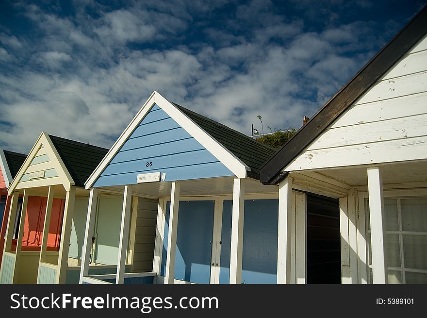 Colourful beach huts and lovely sky at southwold england. Colourful beach huts and lovely sky at southwold england