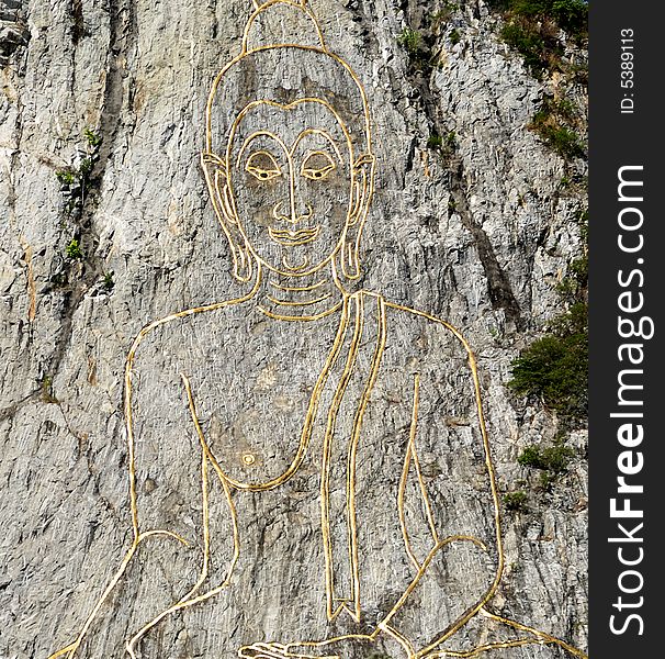 Thailand Pattaya; the Khao chichan's engraved Buddha effigy is carved on the surface of a natural rock. Thailand Pattaya; the Khao chichan's engraved Buddha effigy is carved on the surface of a natural rock