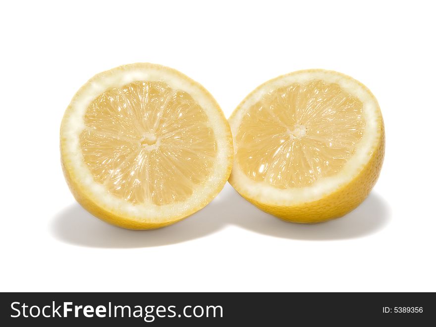 Fresh cut lemon on white background