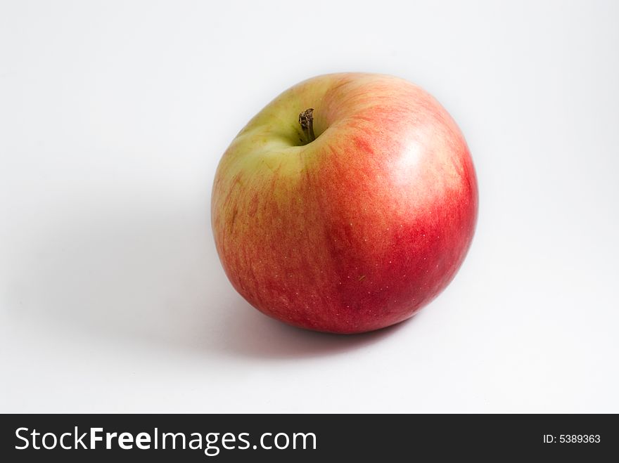 Natural red apple on white background