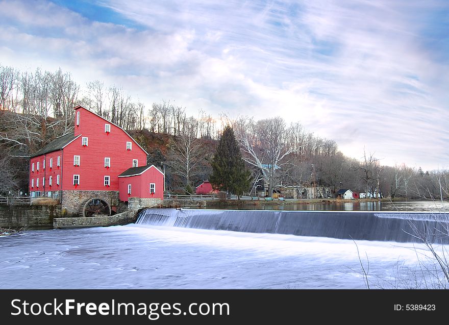 Old mill and waterfall in winter. Old mill and waterfall in winter