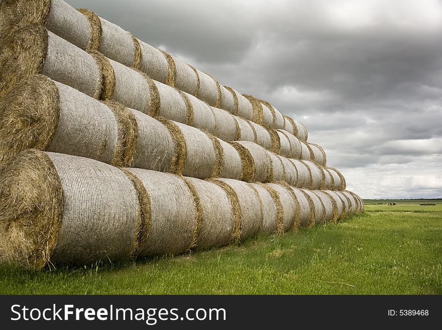 Bales of straw and cloudy sky