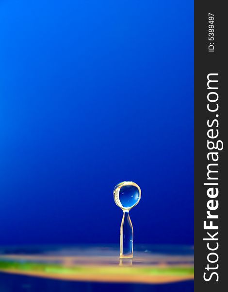 Water drop on blue background