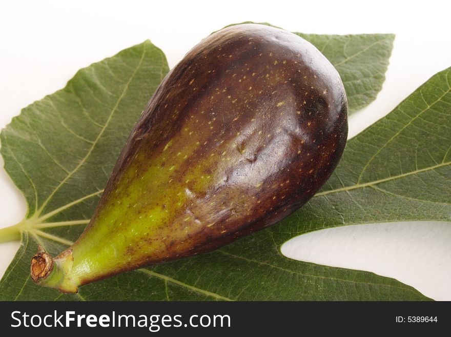 Close up of fresh fig on a leave. Close up of fresh fig on a leave