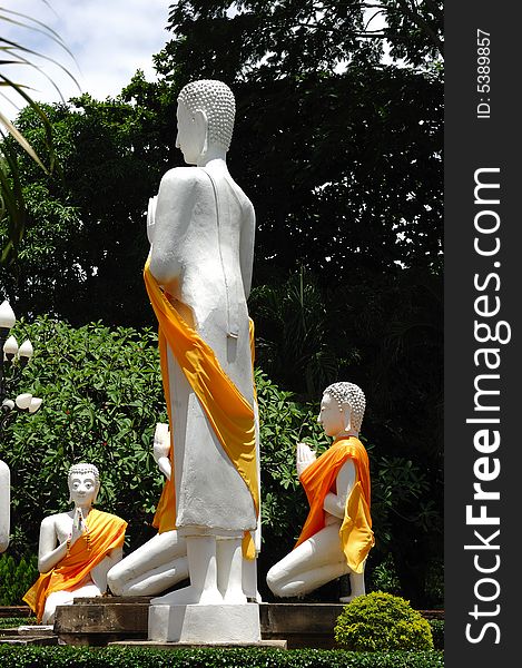 In Thailand the city of Ayutthaya was founded in 1350 today is an impressive archaeological park; here a view of prayers statues at Wat Yai Chai Mongkhon. In Thailand the city of Ayutthaya was founded in 1350 today is an impressive archaeological park; here a view of prayers statues at Wat Yai Chai Mongkhon