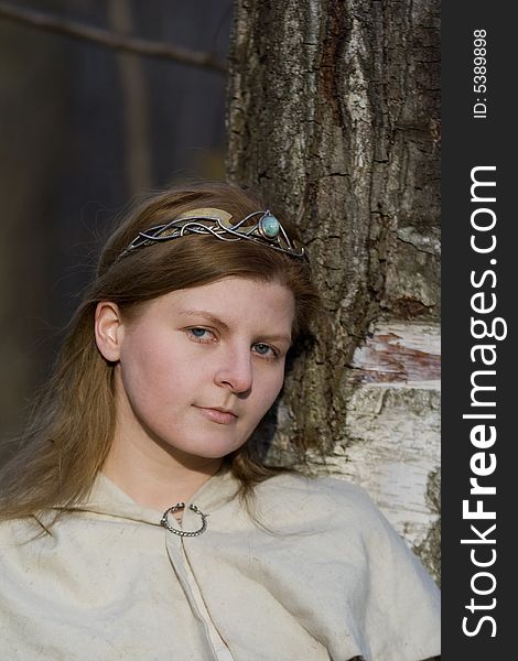 Portrait of the romantic girl in autumn forest. Portrait of the romantic girl in autumn forest