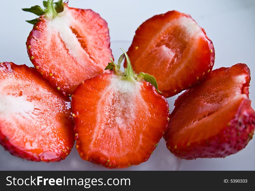 Sliced strawberries on white background. Sliced strawberries on white background