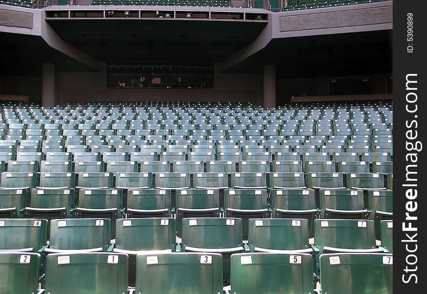 Rows of green folded theater seats