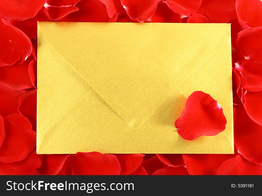 Gold envelope on Red Rose petals