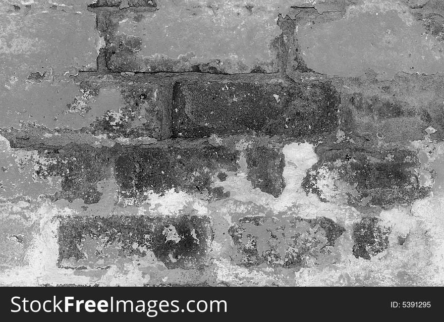 A close-up of a flaking brick wall. A close-up of a flaking brick wall