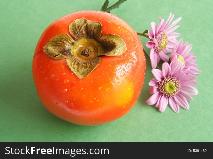 Fresh Kaki fruit on green  back ground