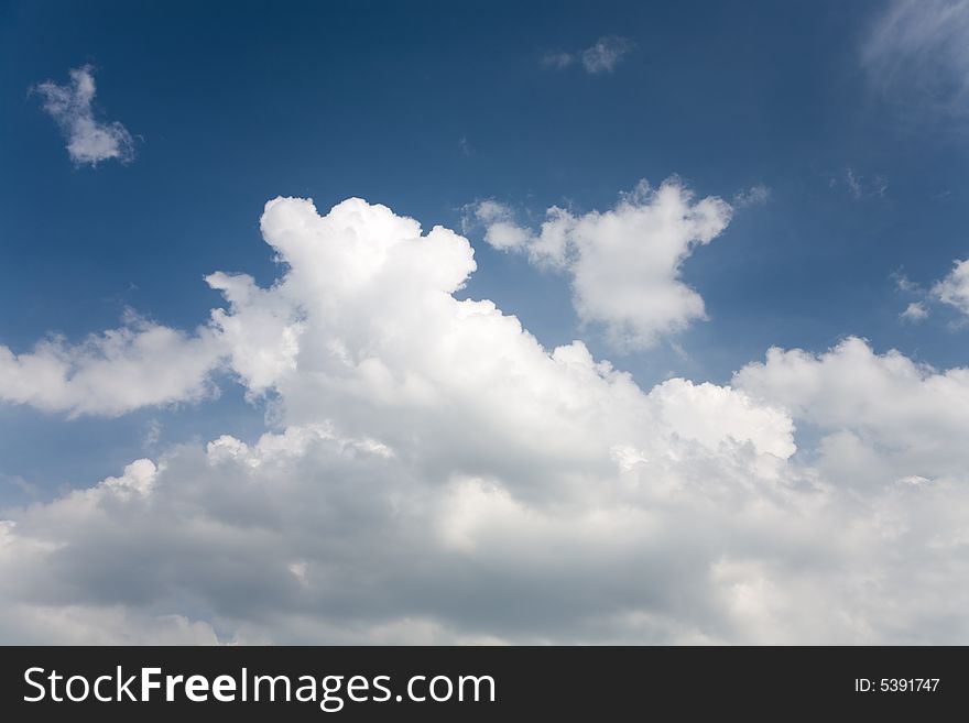 A photo of a sky with some clouds. A photo of a sky with some clouds